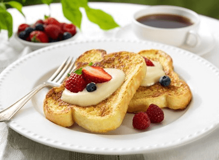 D’Italiano thick sliced white bread turned into French toast topped with mascarpone cheese and fresh berries