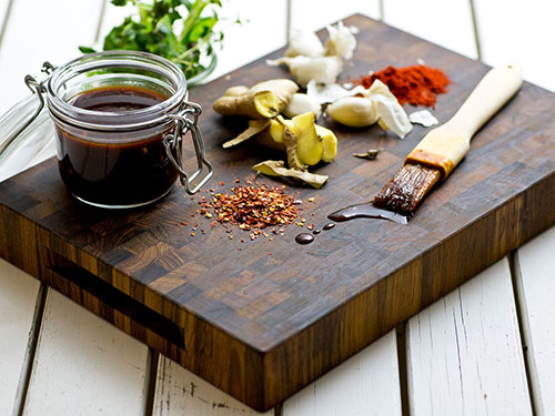 BBQ sauce on cutting board ready for the grill